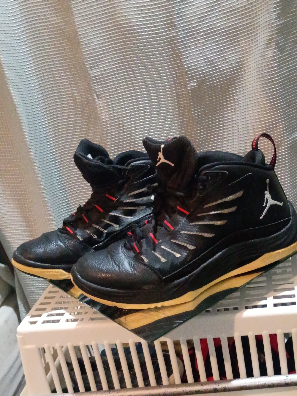 Jordan Men’s Black Basketball Shoes with Red Accents and Cream Midsoles